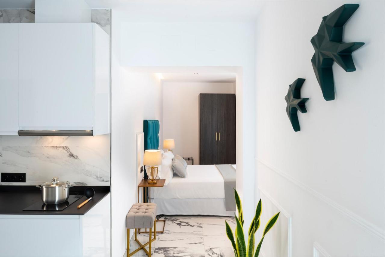 Quivir Apartamentos Deluxe Casa Del Arco Andujar Bagian luar foto