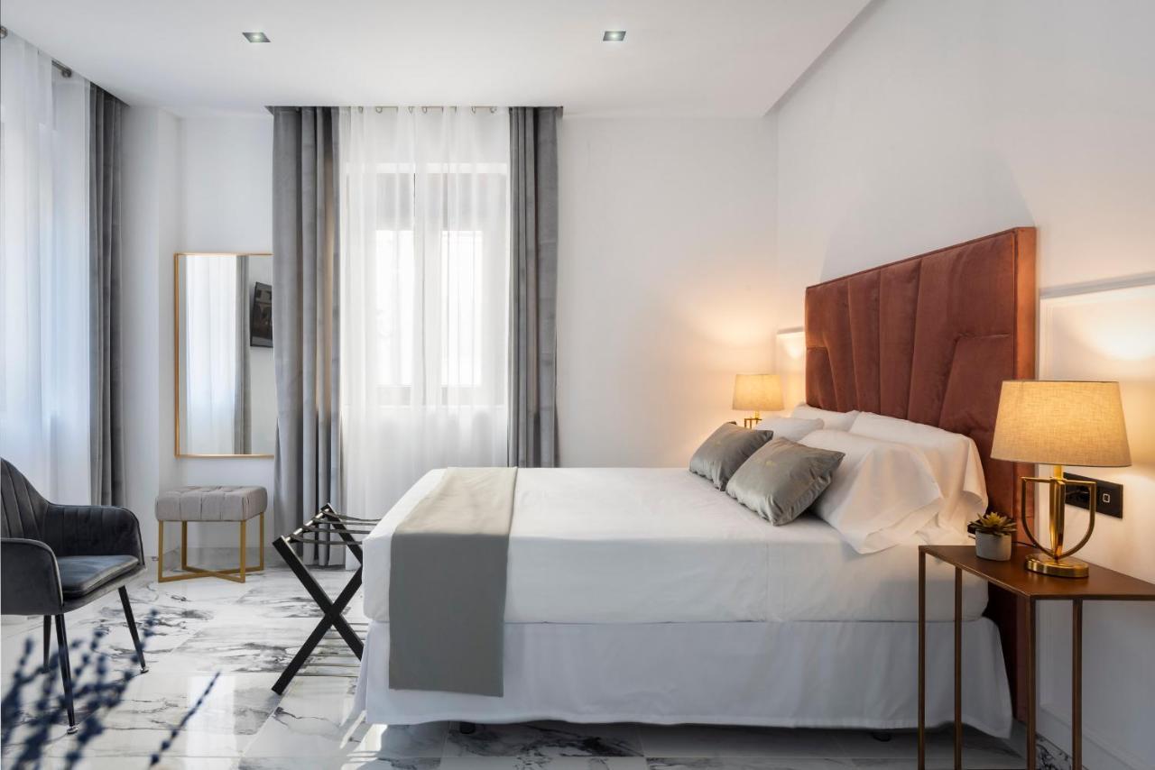 Quivir Apartamentos Deluxe Casa Del Arco Andujar Bagian luar foto